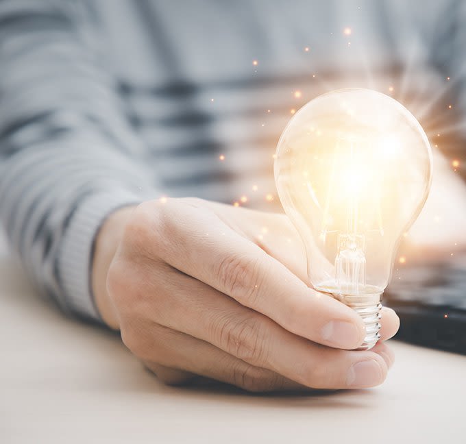 Man holding a light bulb