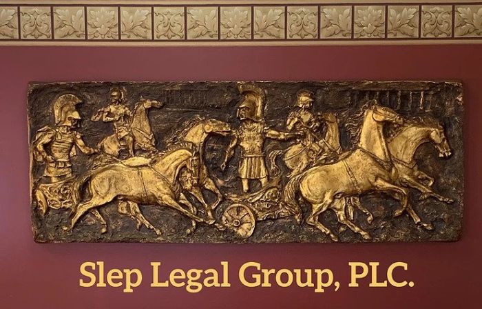 Shep Legal Group, PLC graphic under a roman art carving