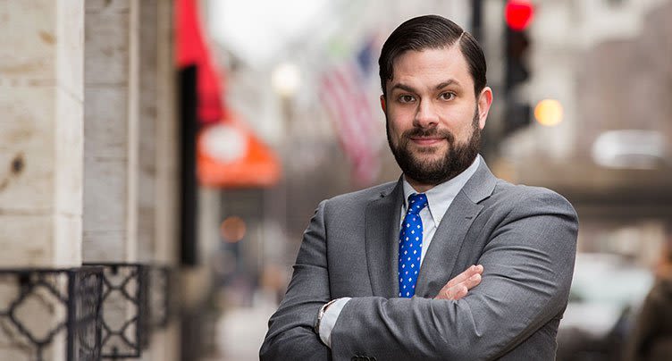 Attorney Todd A. Eiler in Gray Suit Crossing Arms