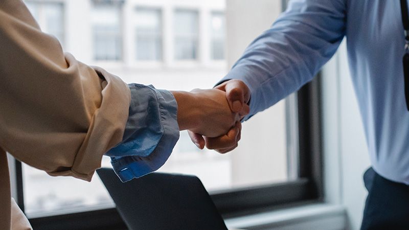 Man and woman shaking hands