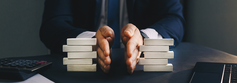 A man separates a stack of blocks in half
