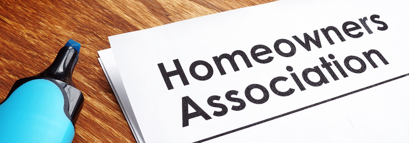 Documents about Homeowners Association HOA on a desk.