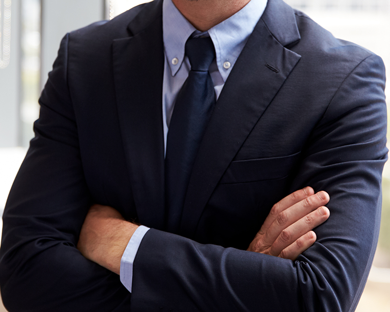 Businessman Standing By Window In Office
