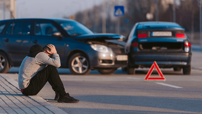 A man frustrated after a car accident
