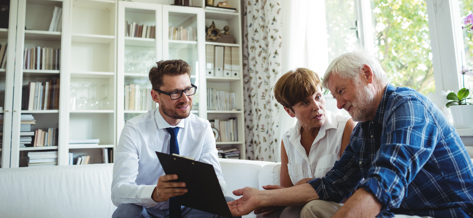 Older couple speaking to a financial advisor
