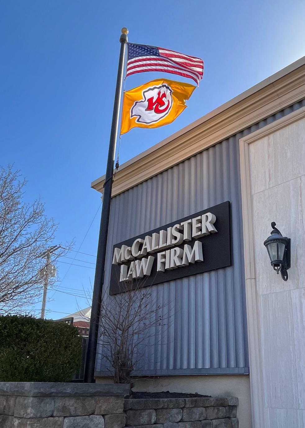 Flags flying in front of McCallister Law Firm