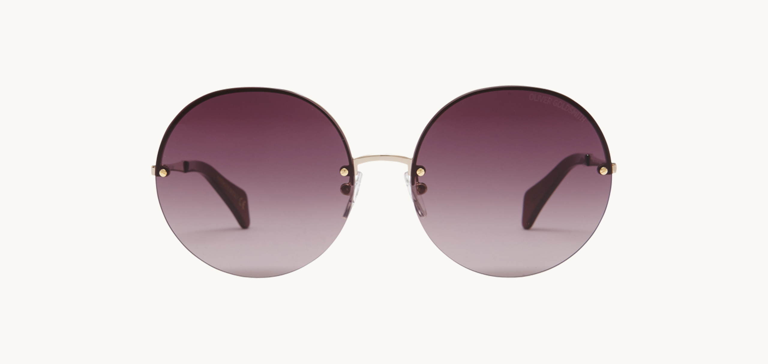 Lunettes de soleil 1970's - , Oliver Goldsmith, Ronde , de couleur Dorée Violet.