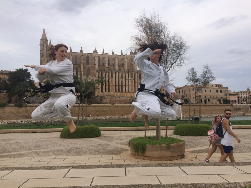 me doing a spinning kick in front of Cathedral