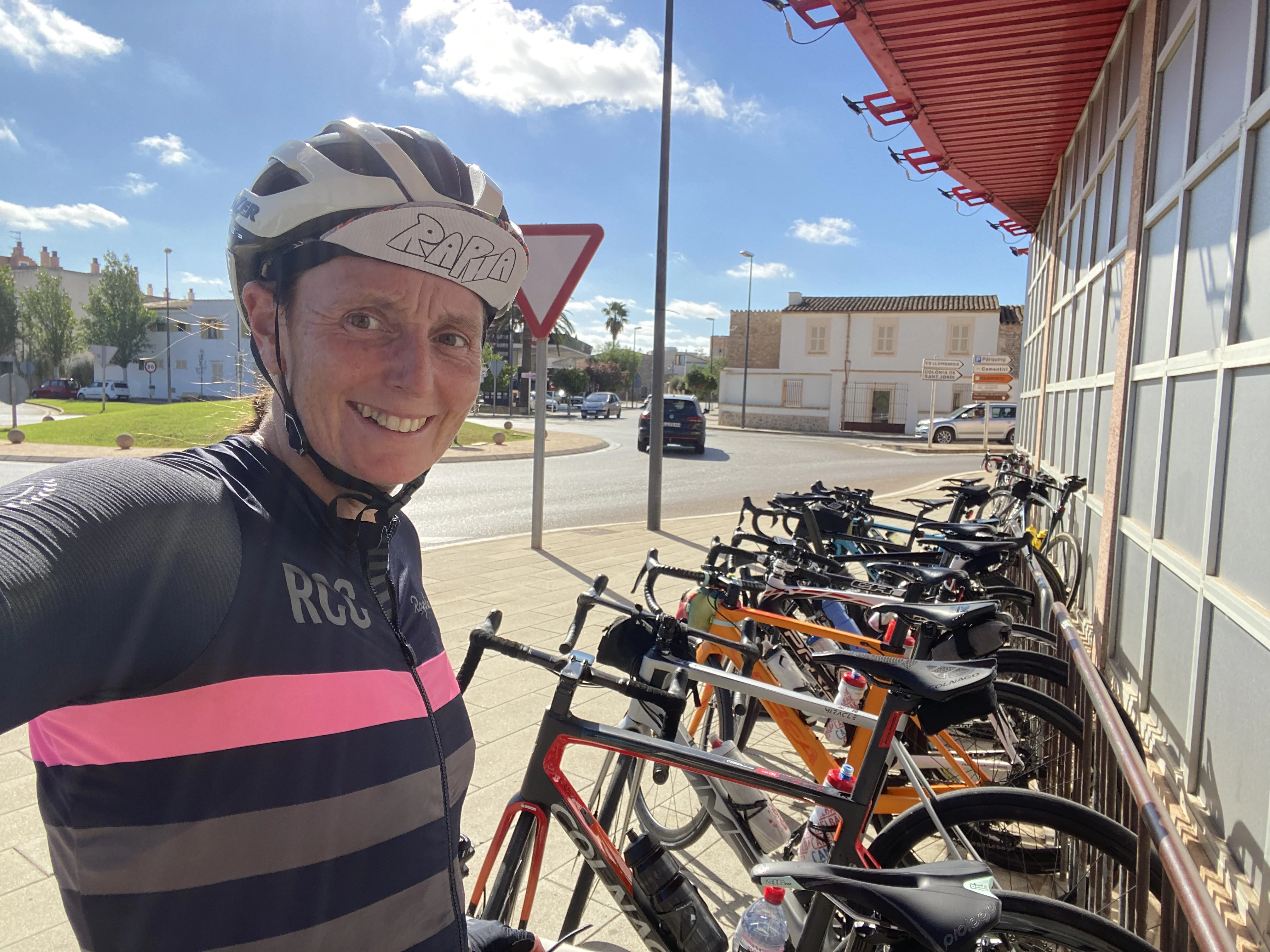 at the supermarket in cycling gear in front of lots of bikes