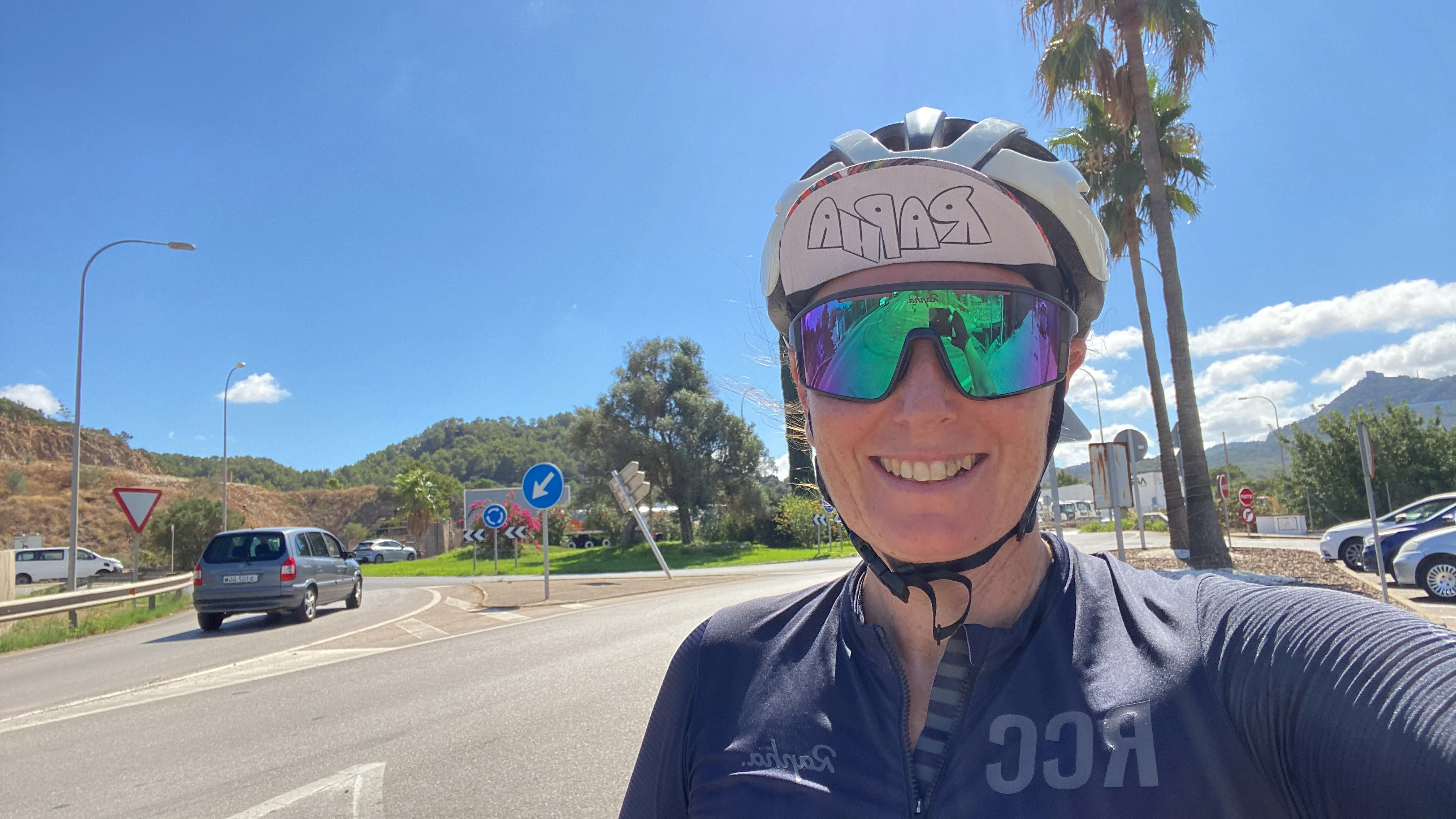 me in cycling gear on a road smiling