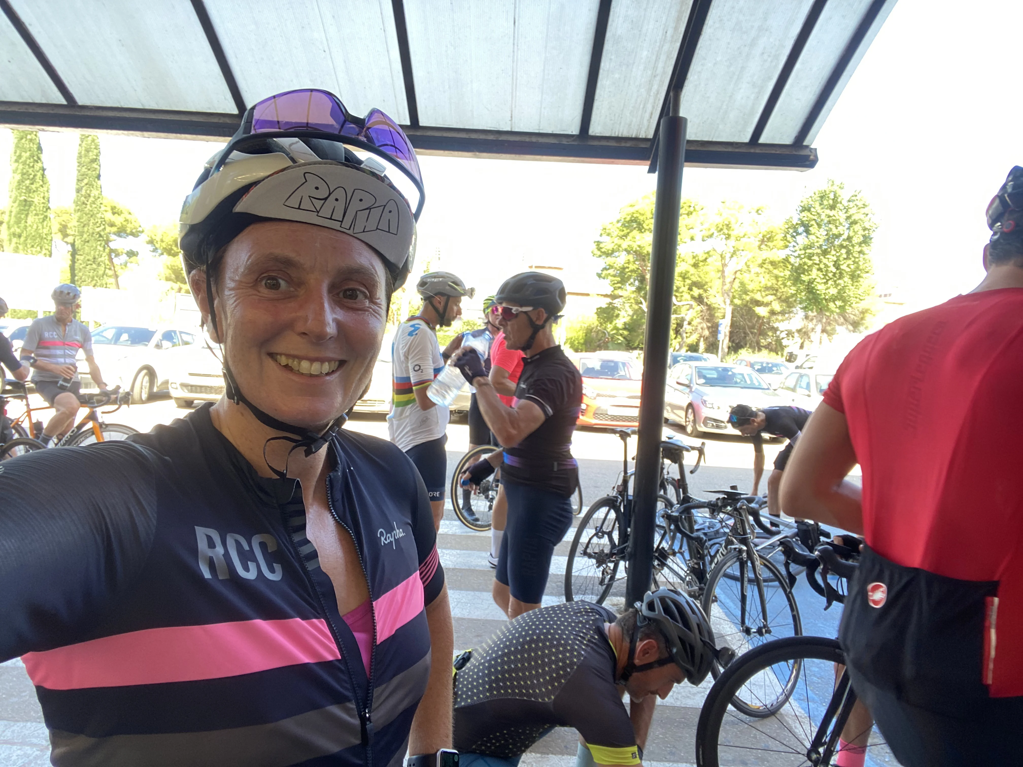 me in cycling gear at a cafe with other cyclists getting ready to leave