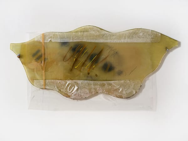 Also Bathroom Mirror Piece, 2024; burnt bathroom mirror, paper, paint, plastic, lead, rubber band; 17 x 32 x 1". Photography by Brica Wilcox.