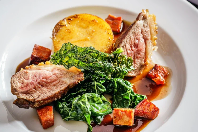 Porcloin with red wine sauce on a dish