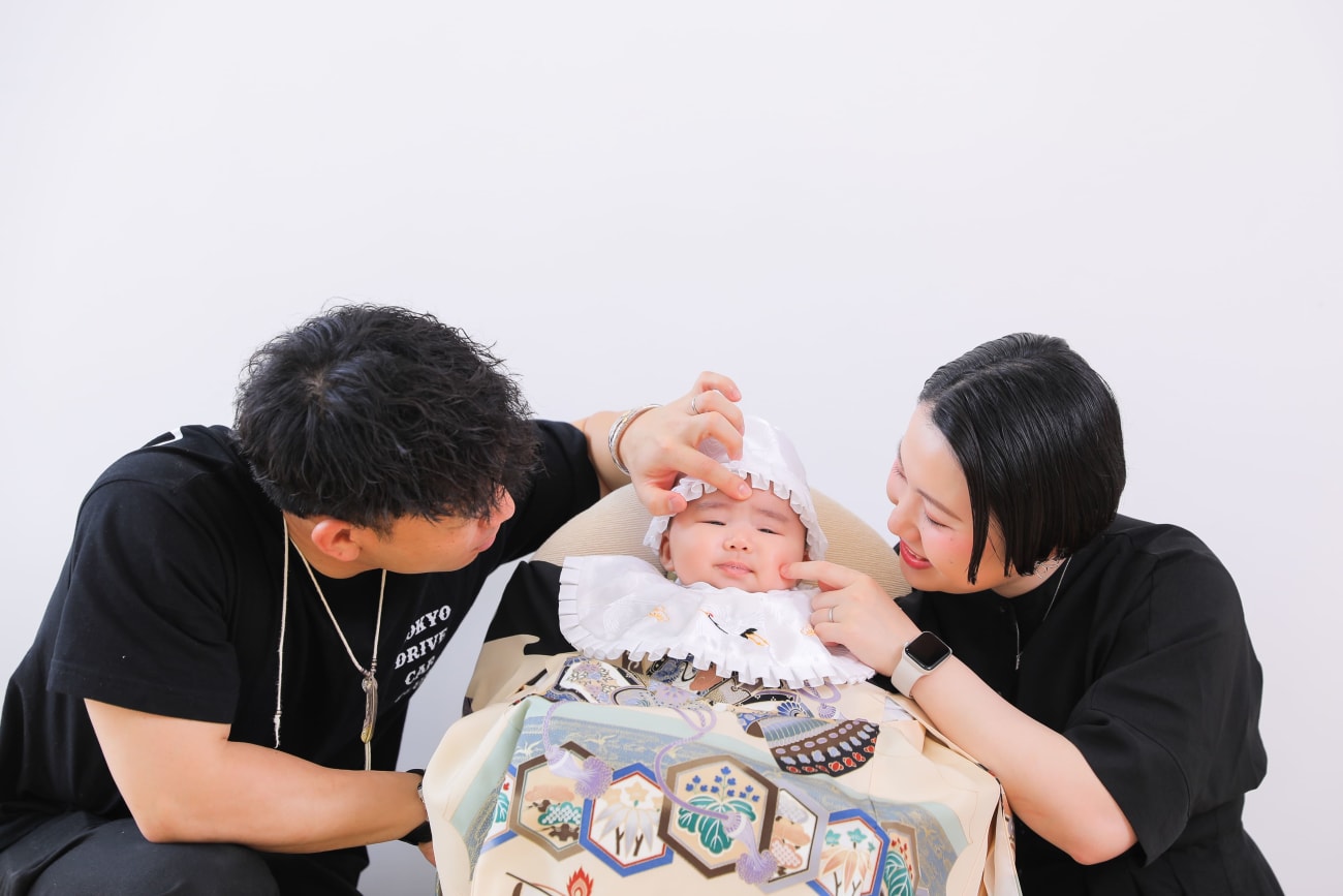 特別な掛け着を羽織って