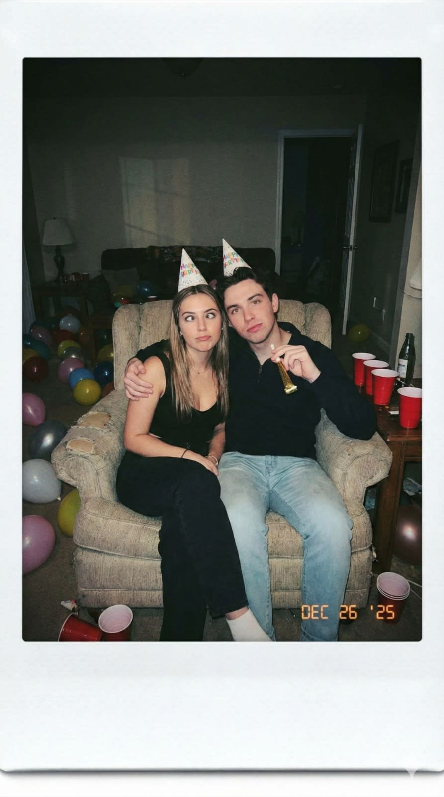  Generate a Polaroid photo of two people in an intimate group shot, maintaining facial consistency. The photo has a slight blur effect, taken indoors with flash,{as if just after a party, with the two people in an intimate yet funny pose.} 
go with 9:16 aspect ratio