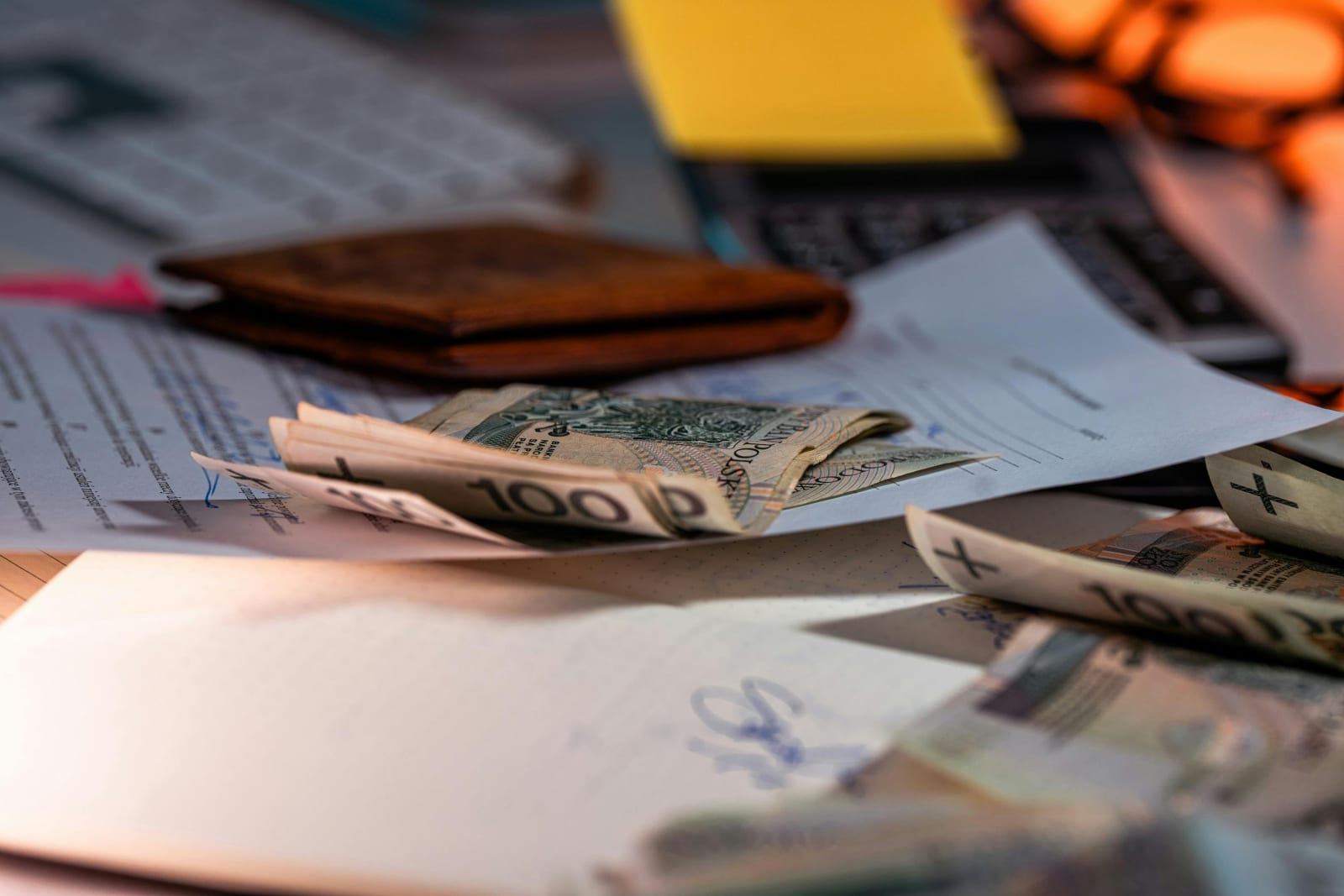 Financial documents and money on desk