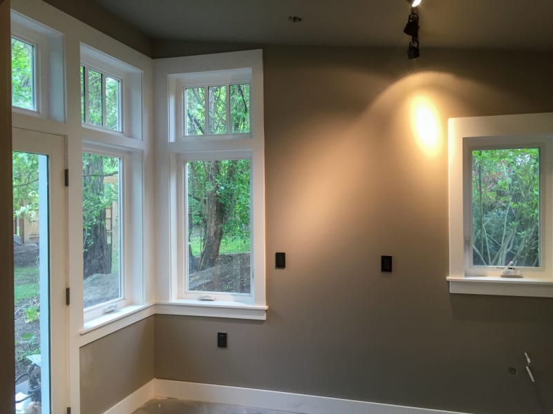 This clean and modern space features windows installed by NIB, located in Spokane, WA. The large, well-placed windows provide abundant natural light, creating a bright and welcoming atmosphere. The sleek design of the windows and the high-quality craftsmanship bring elegance to this home, seamlessly blending with the clean lines of the interior. NIB's expert window installation ensures long-lasting beauty and functionality for the home.