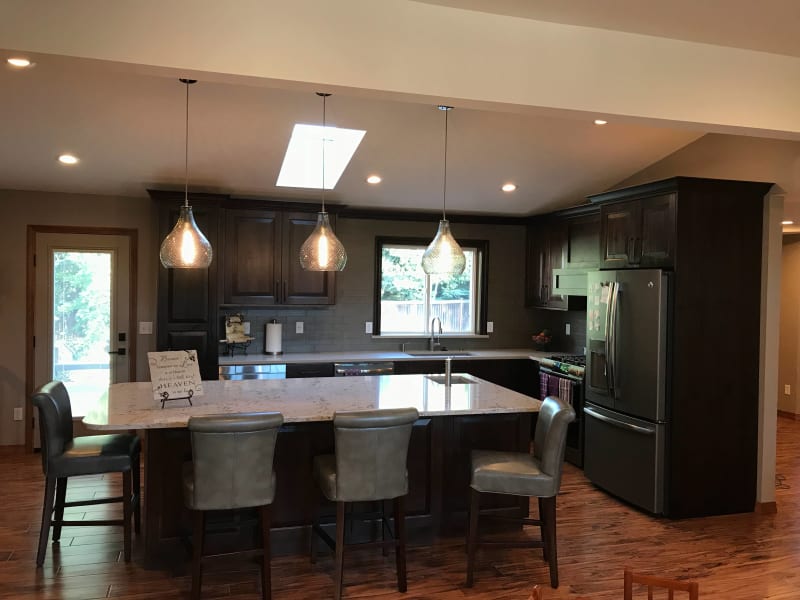 This beautifully renovated kitchen showcases NIB's top-tier window installation, bringing in an abundance of natural light while enhancing the space’s overall charm. Located in Spokane, WA, this kitchen features modern finishes, including sleek granite countertops and sophisticated cabinetry, all while benefitting from the quality window installation by NIB. The careful craftsmanship not only complements the style but also ensures energy efficiency, perfect for any modern home.