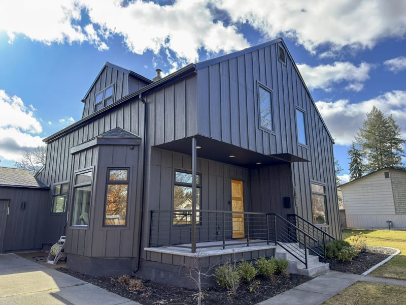 The completed siding installation on a home in Spokane, WA, by NIB. The clean, modern design features durable, high-quality materials that are both functional and stylish. The crisp lines of the siding create a sleek aesthetic, perfectly complemented by the architectural details of the home. With precise installation and expert craftsmanship, NIB ensured the siding not only looks fantastic but will stand the test of time, enhancing the home’s exterior for years to come. The bright, clear skies in the background show off the finished product in full.