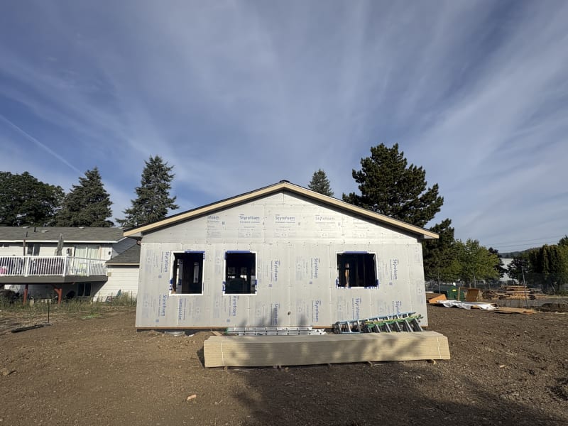 The exterior of a home addition project, still in its early stages, shows the Styrofoam insulation and framing in place. Located in Spokane, WA, the work is being carried out by NIB, demonstrating their ability to handle various aspects of home addition construction.