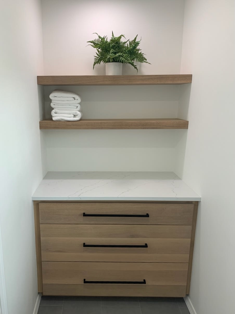 Small updated bathroom shelving and vanity in nook