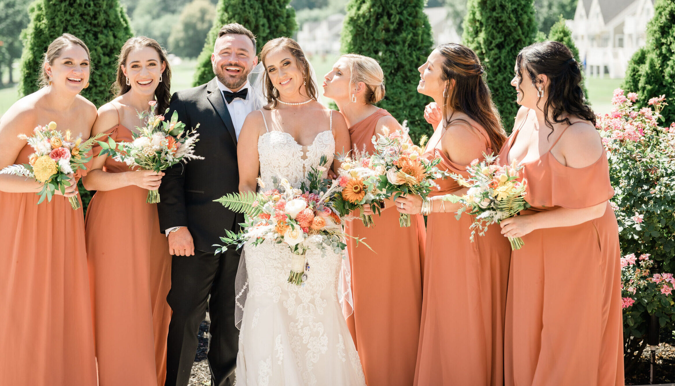 Bridesmaids holding custom wedding bouquets designed by Wilmington MA wedding florist Designs By Don
