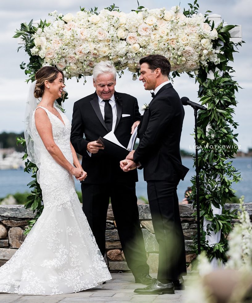 Wedding ceremony floral arch and bridal bouquet by Wilmington MA wedding florist Designs By Don