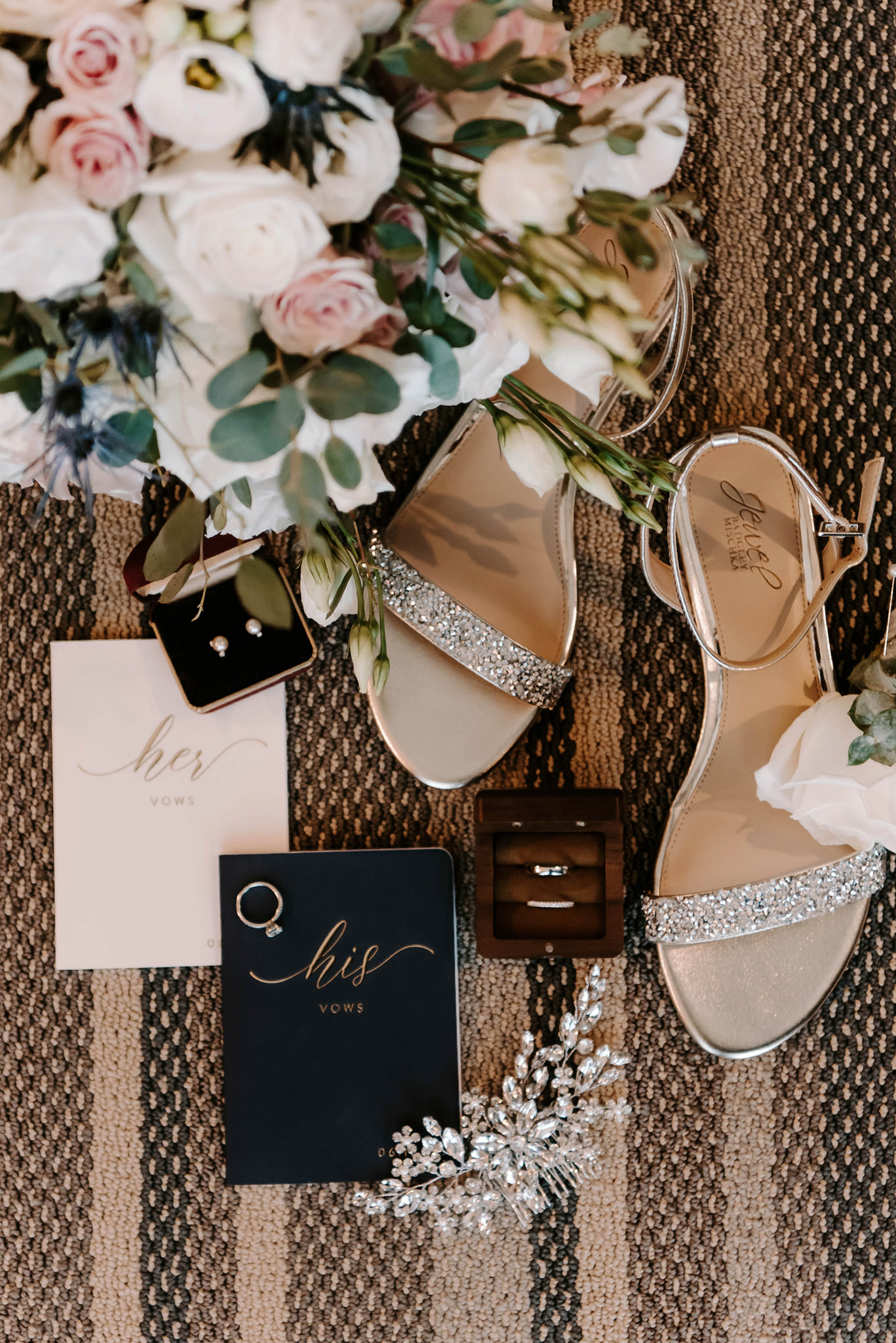 Wedding detail photo with floral accents and bridal shoes.