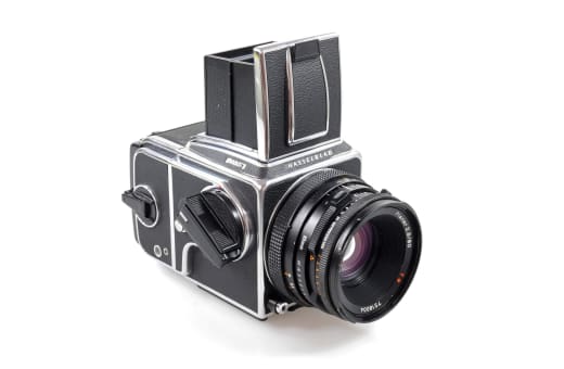 Hasselblad 500 or Mamiya RB67 medium format SLR camera with lens