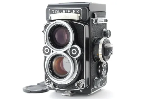 Rolleiflex or Yashica Mat TLR camera showing the twin lenses from the front
