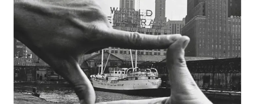 Subject photographed through a doorway or stone archway, using the architecture as a natural frame