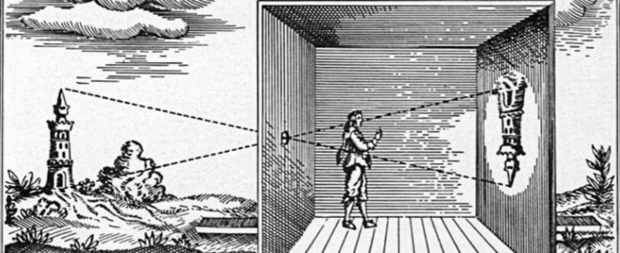 A camera obscura — a darkened box or room projecting an inverted image of the outside world