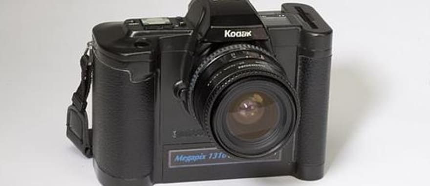 An early Nikon D1 or Canon Digital Rebel DSLR camera from the early 2000s