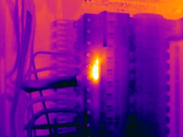Thermal image showing abnormal heating within miniature circuit breakers, indicating possible internal deterioration or increased contact resistance