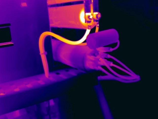 Thermal image showing abnormal heating associated with a developing capacitor defect within a UPS system