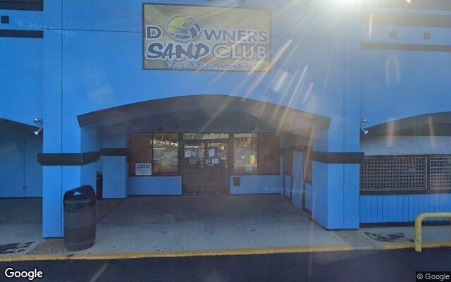 Street-level view of Downers Sand Club Sports Bar & Grill