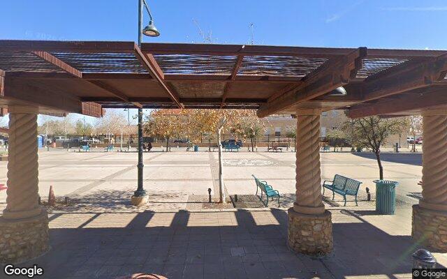 Street-level view of Plaza de Las Cruces