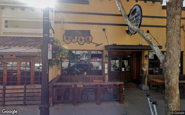 Street-level view of Old Wagon Saloon & Grill
