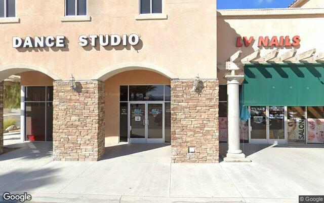 Street-level view of Step By Step Dance Studio