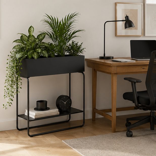 Black metal raised planter box used as a modern plant stand in a home office