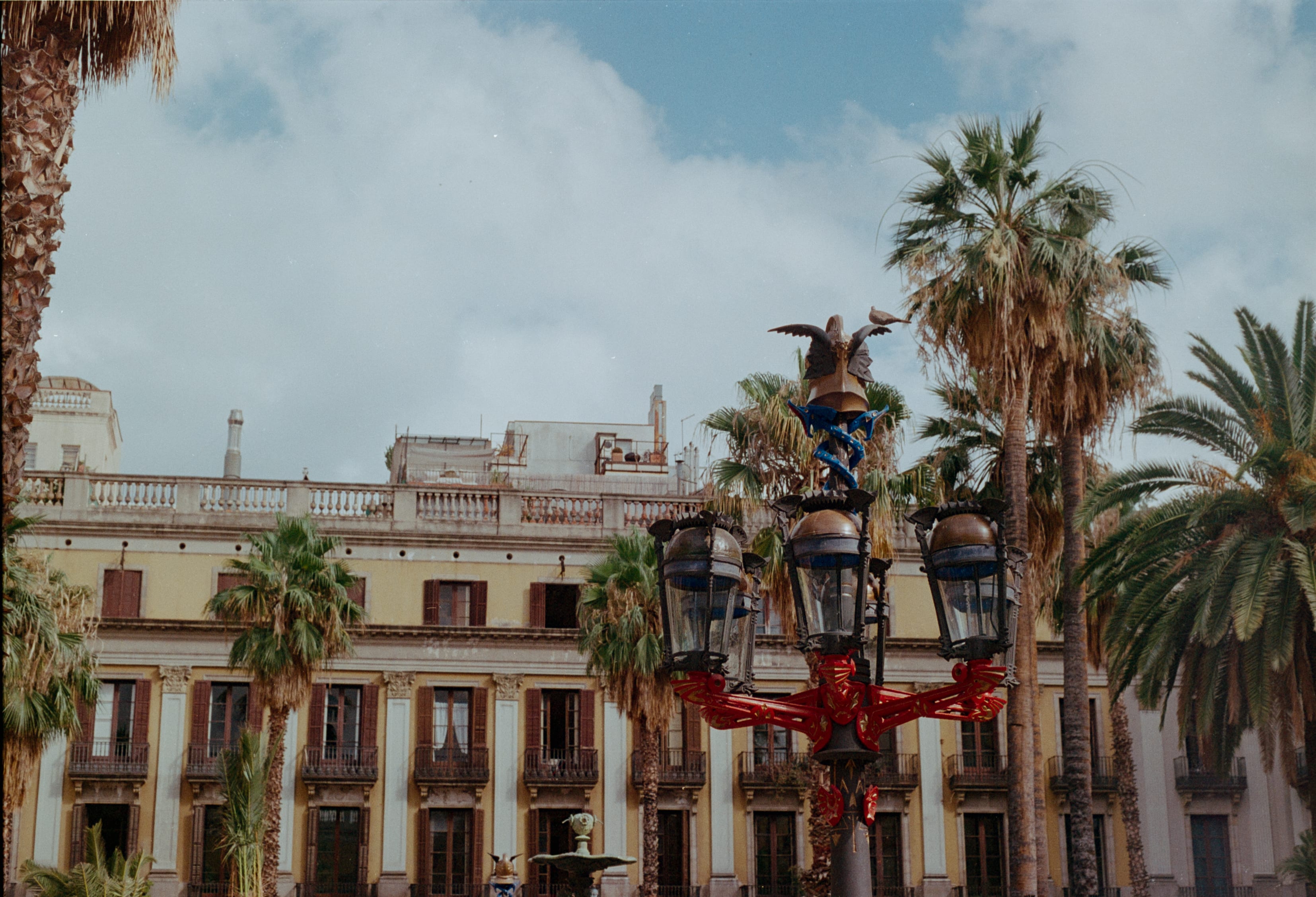 Palm trees and a Gaudí lamppost in Plaça Reial