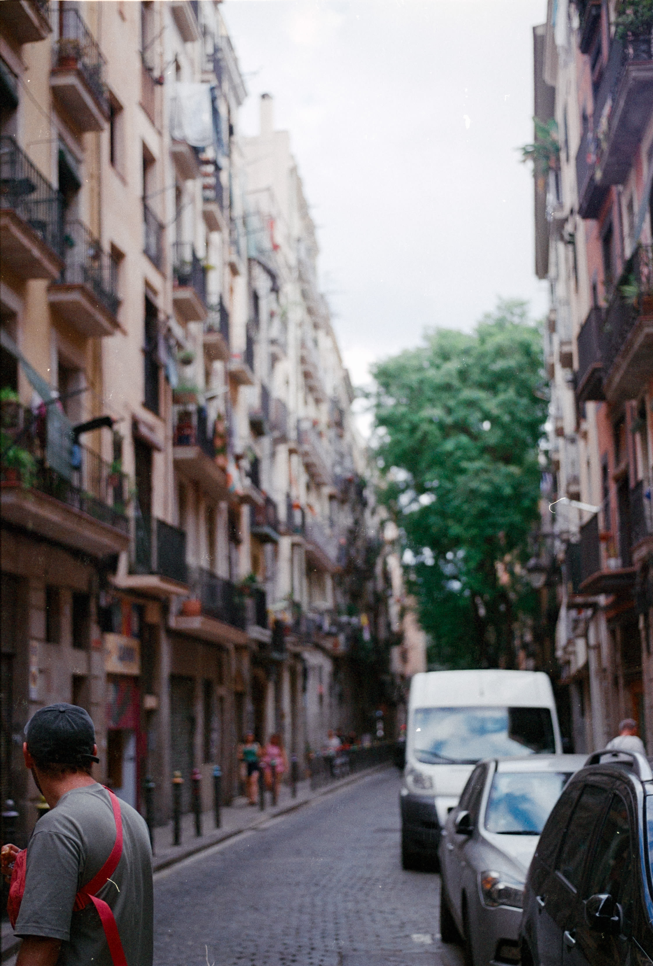 A narrow street lined with balconies