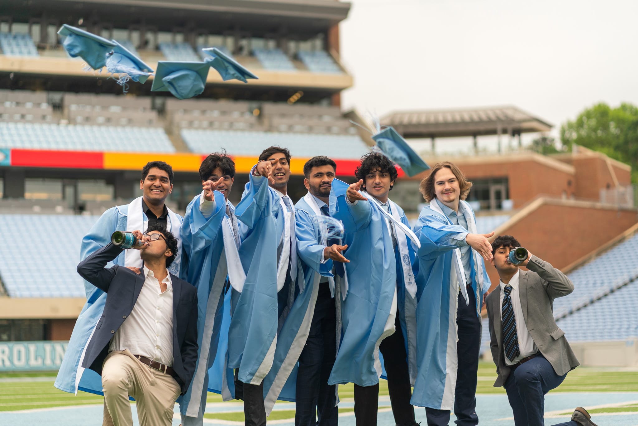 Grads throwing their caps at Kenan Stadium