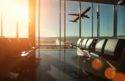 Airport departure lounge with airplane view