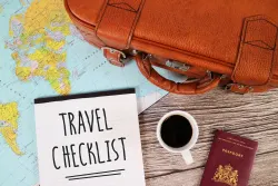 Travel checklist with passport and coffee