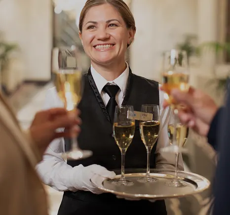 Waiter setting a table