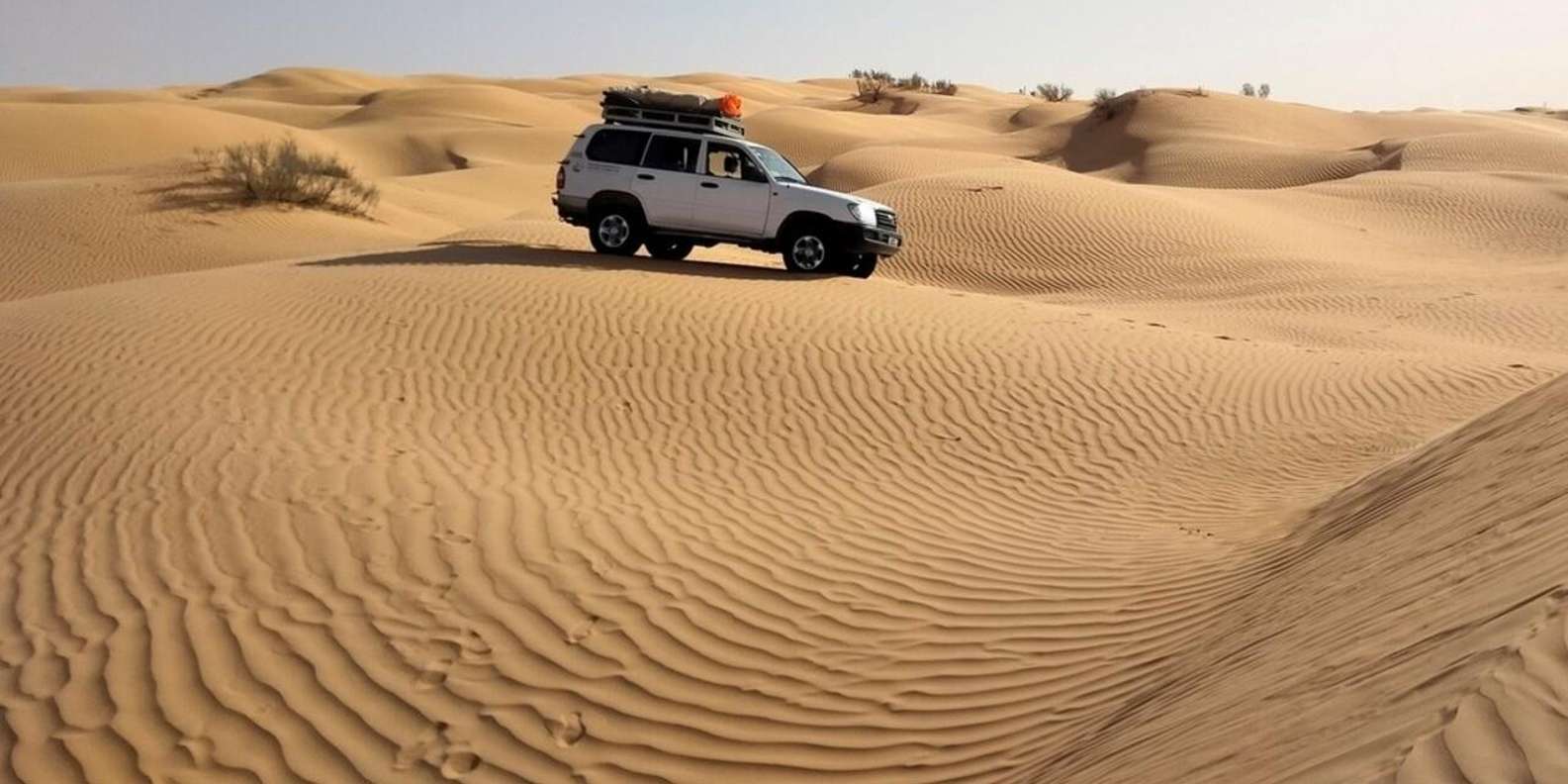 Transfer-to-jeeps-and-start-the-desert-safari-ride-in-a-caravan-of-jeeps.webp