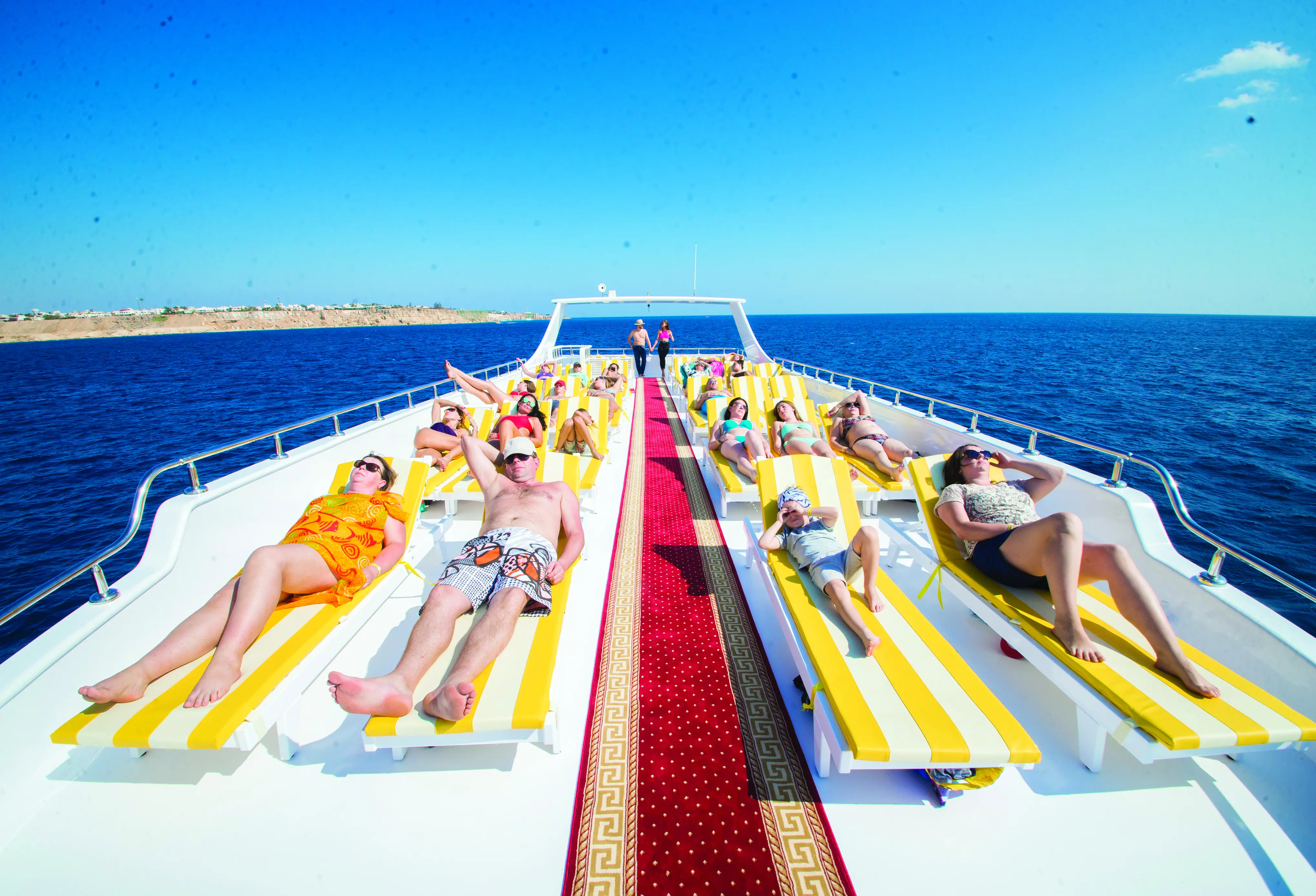 luxury-boat-trip-lounging-on-the-chaise-longue-dinner-program.webp