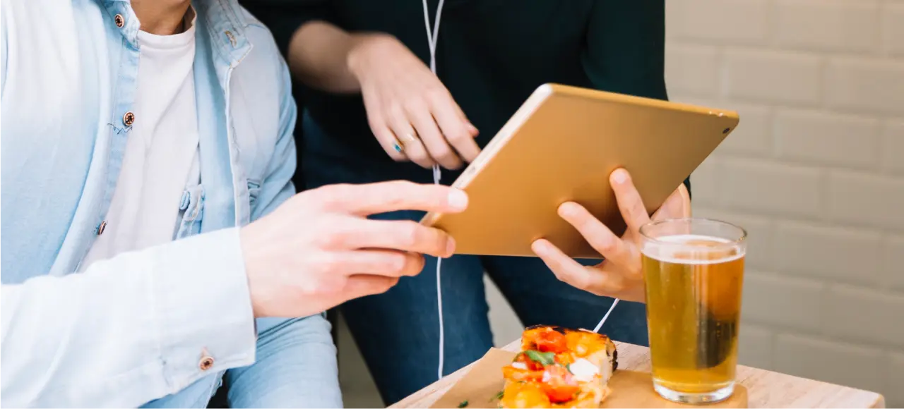 two men using a tablet