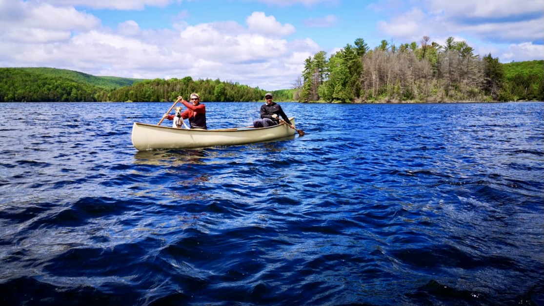Thomas, Andrew, and Mac in a canoe